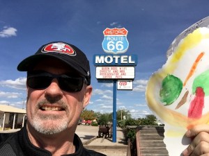 Me holding a large lollipop my granddaughter, Payton, gave me the day before I left.