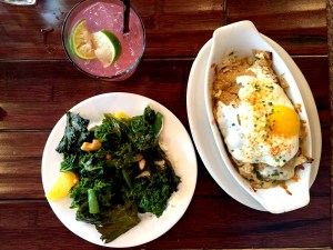 Kale Salad (yogurt, chipotle honey vinaigrette, snap peas, hard boiled eggs, oranges); and  Chilaquiles (chicken, salsa verde, melted cheese, sunny egg)